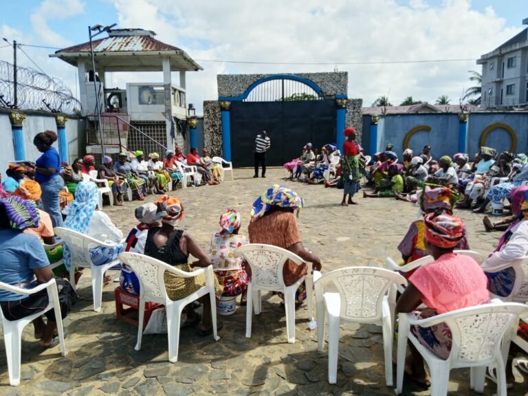 Participants seated in a circle during the VSLA training