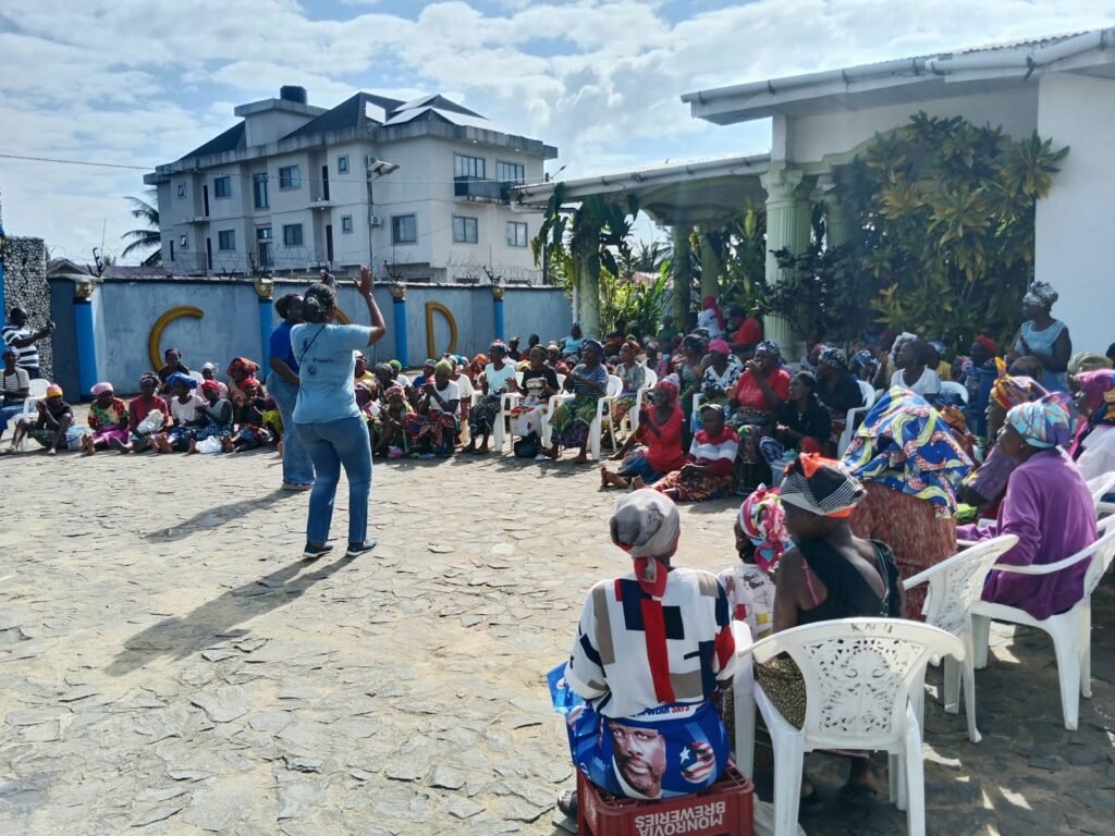 A facilitator addressing the women at the training