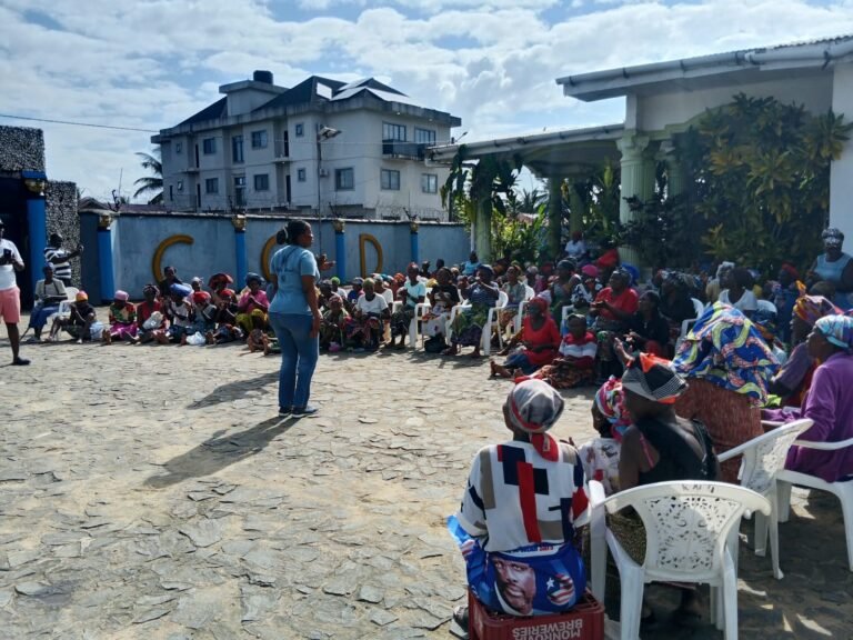 A facilitator speaking to the gathered participants